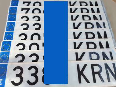 Selection of the latest Spanish registration plates waiting to fitted to customers' vehicles Spanish number plates